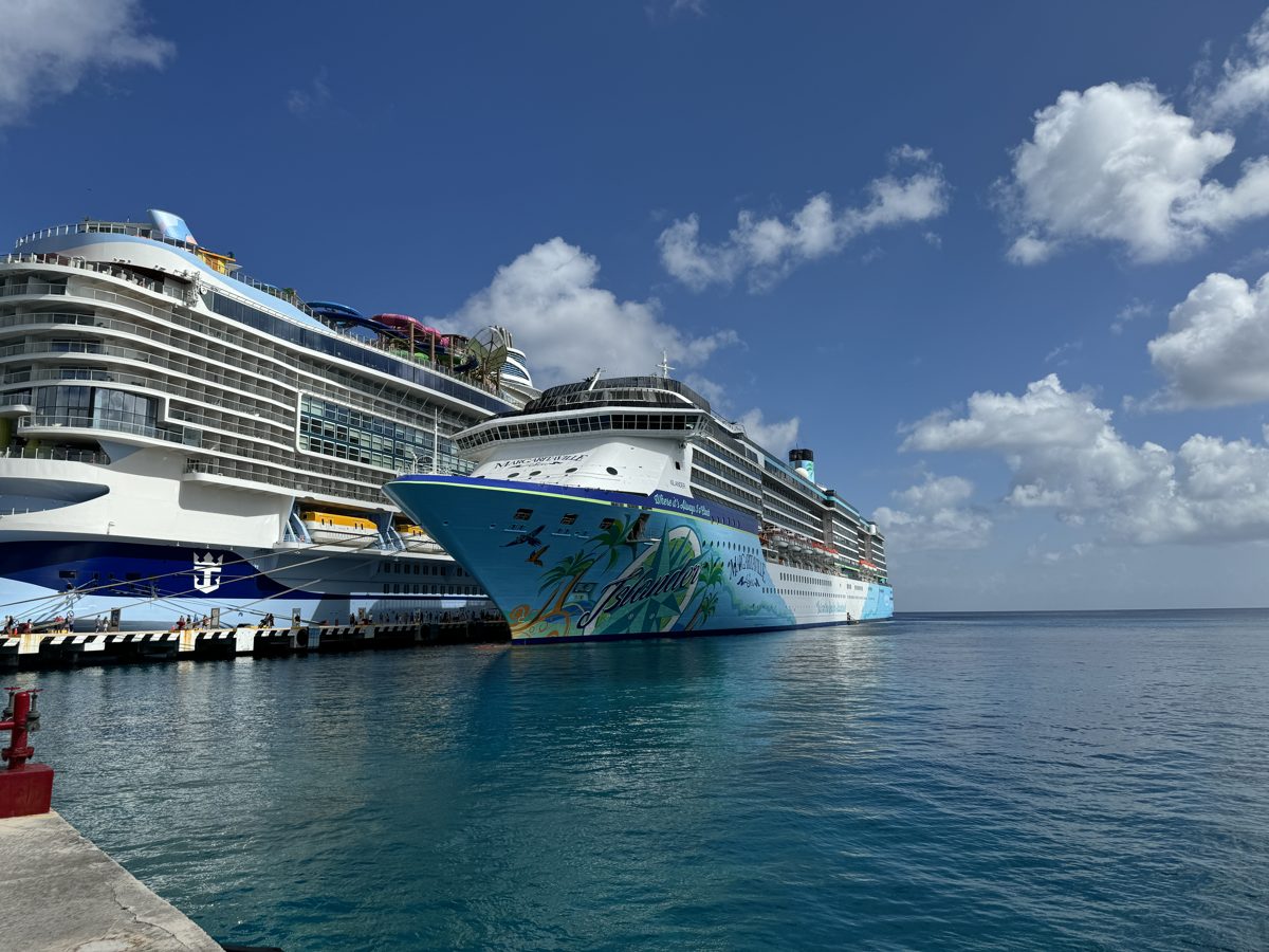 Cruise ships docked in port under a blue sky