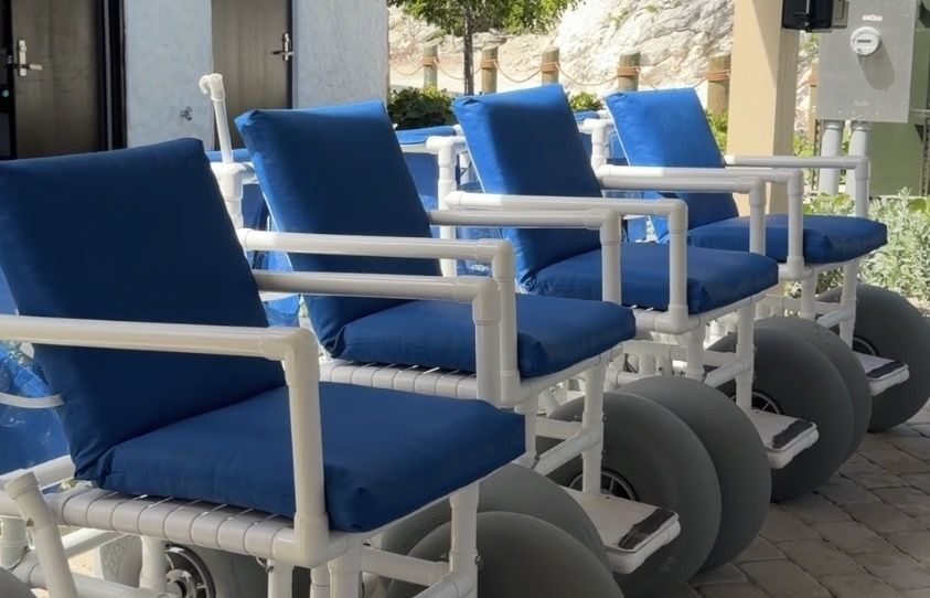 Beach wheelchairs lined up and ready to use at the Lime tram stop